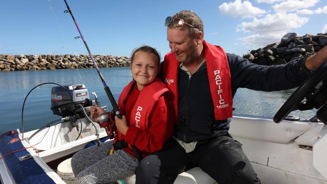 Father and daughter anglers Charles Male and Sasha Carr-Male, 9, from Marion, at West Beach boat ramp. Picture: Emma Brasier