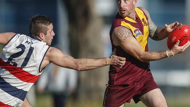 New signing Charlie O'Neill (Highett) lays a tackle on Liam Wilson (Murrumbeena). Picture: Valeriu Campan