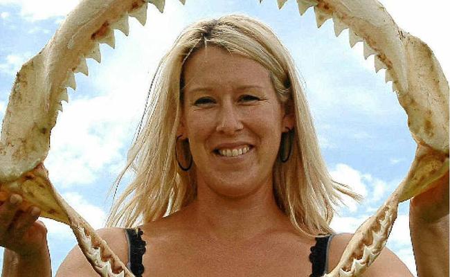 Warregah Island mother Annette Lenard with the jaws of the bull shark her husband caught last weekend. . Picture: Debrah Novak