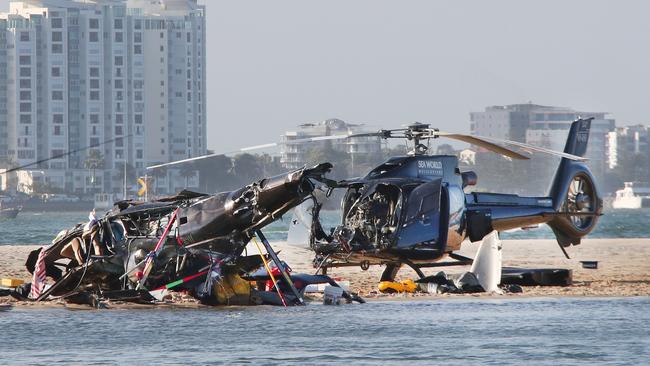 The devastating scene of a Helicopter crash between two Sea World Helicopters just outside the tourist park on a sandbank in the Southport Broadwater. Picture: Glenn Hampson