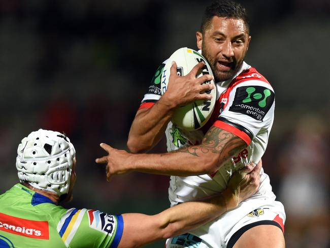 Benji Marshall (right) of the Dragons is tackled by Jarrod Croker of the Raiders during the round 10 NRL match between the St George Illawarra Dragons and the Canberra Raiders at WIN Jubilee Oval in Sydney on Thursday, May 12, 2016. (AAP Image/Paul Miller) NO ARCHIVING, EDITORIAL USE ONLY