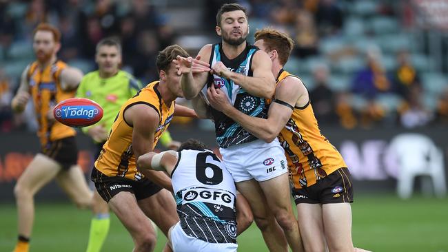 Sam Gray is set upon by a gang of Hawks. Picture: AAP Images