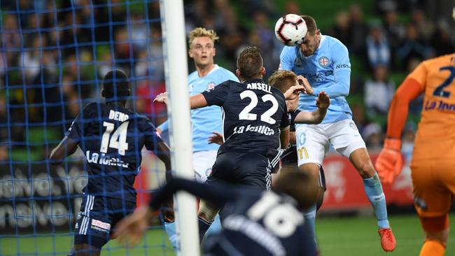 Dario Vidosic heads home the equaliser for City in the Melbourne derby. Picture: AAP