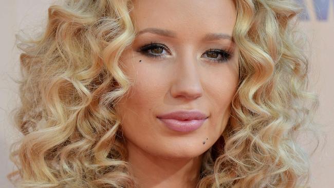 Rapper Iggy Azalea rocks a curly look.