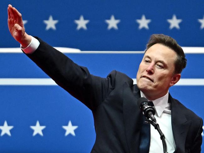 Tesla and SpaceX CEO Elon Musk gestures as he speaks during the inaugural parade inside Capitol One Arena, in Washington, DC, on January 20, 2025. (Photo by ANGELA WEISS / AFP)