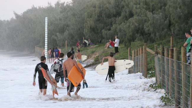 Storm swells surge against the dunes and the lifeguard tower at Mooloolabah. PHOTO: BRETT WORTMAN / SUNSHINE COAST DAILY