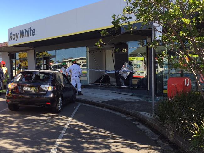 Bateau Bay crash: Emergency services on the scene where at car has driven into the front of Ray White Real Estate agent at Bateau Bay. Picture Richard Noone.