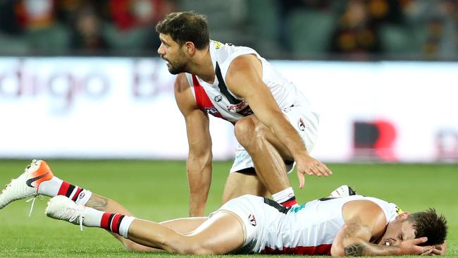 Paddy Ryder checks on the wellbeing of Josh Battle after a heavy clash.