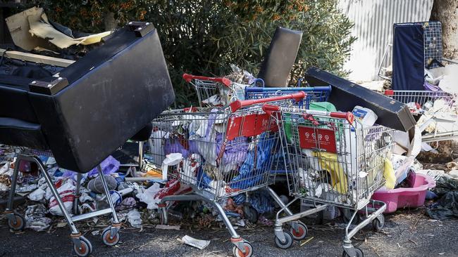 Trash at the rear of a Housing Trust unit block in Sturt in 2017.