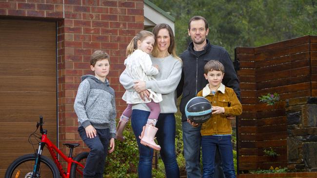 Aaron and Danielle Ward with their children Lachlan, Eliana and Ashton at their recently sold property in Crafers. Picture: Emma Brasier