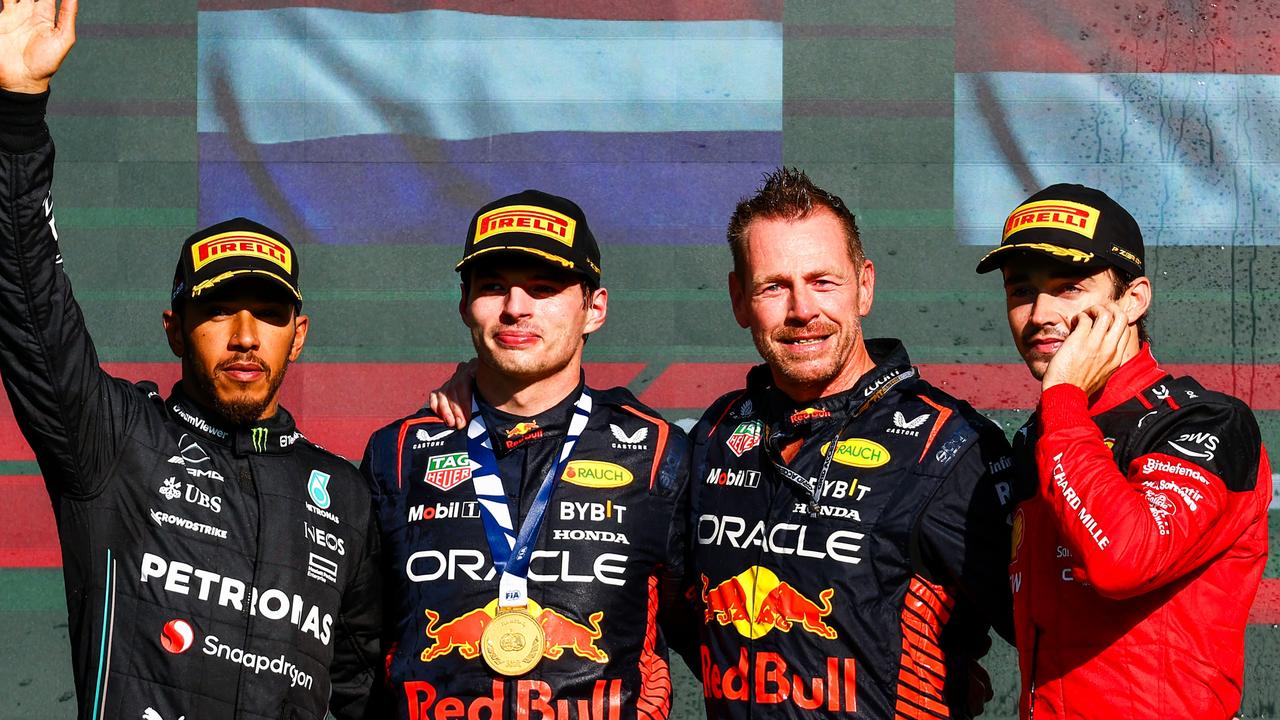 Max Verstappen, Lewis Hamilton and Charles Leclerc and Richard Wolverson of Red Bull Racing celebrate on the podium. Photo by Mark Thompson/Getty Images.