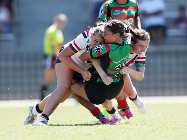 Aliyah McGuiness tackled by Emily-Rose Hall and Jemma Wooden. Picture: Sue Graham