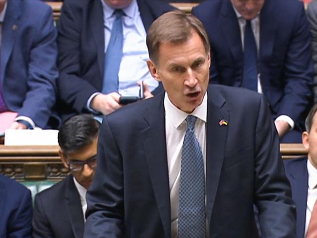 A video grab from footage broadcast by the UK Parliament's Parliamentary Recording Unit (PRU) shows Britain's Chancellor of the Exchequer Jeremy Hunt making an autumn budget statement in the House of Commons in London on November 17, 2022. - Britain is set to unveil hefty tax rises and spending cuts at the risk of worsening a cost-of-living crisis for millions in the recession-bound economy. (Photo by Handout / PRU / AFP) / RESTRICTED TO EDITORIAL USE - NO USE FOR ENTERTAINMENT, SATIRICAL, ADVERTISING PURPOSES - MANDATORY CREDIT 