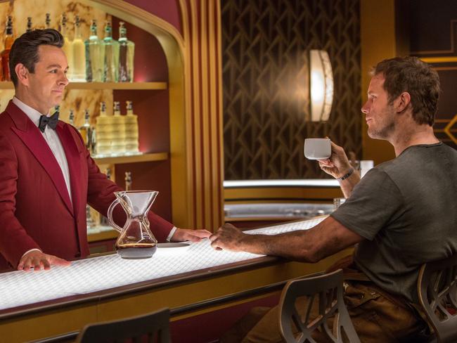 Michael Sheen’s robot bartender Arthur serves the Pod released Jim Preston (played by Chris Pratt). Picture: Supplied