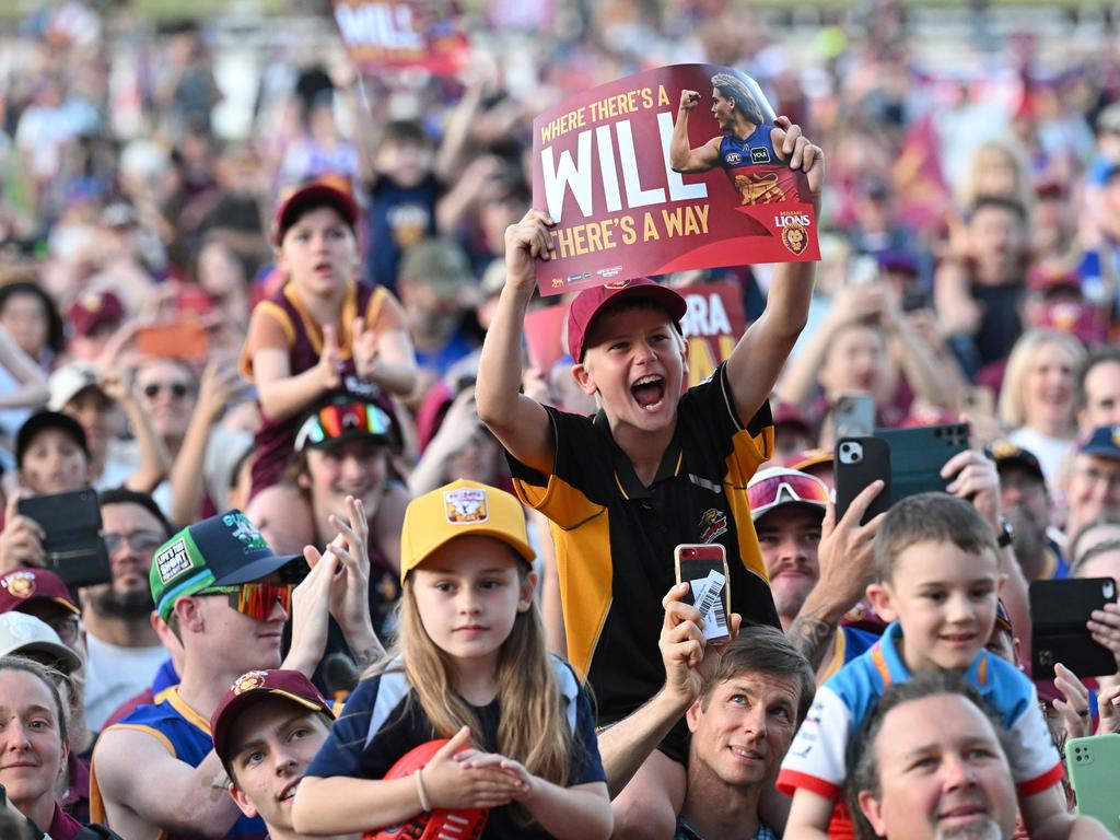 IPSWICH, AUSTRALIA - SEPTEMBER 29: Fans celebrate at Brighton Homes Arena, on September 29, 2024, in Ipswich, Australia. The Brisbane Lions won the 2024 AFL Grand Final yesterday beating Sydney Swans at the MCG. (Photo by Bradley Kanaris/Getty Images)