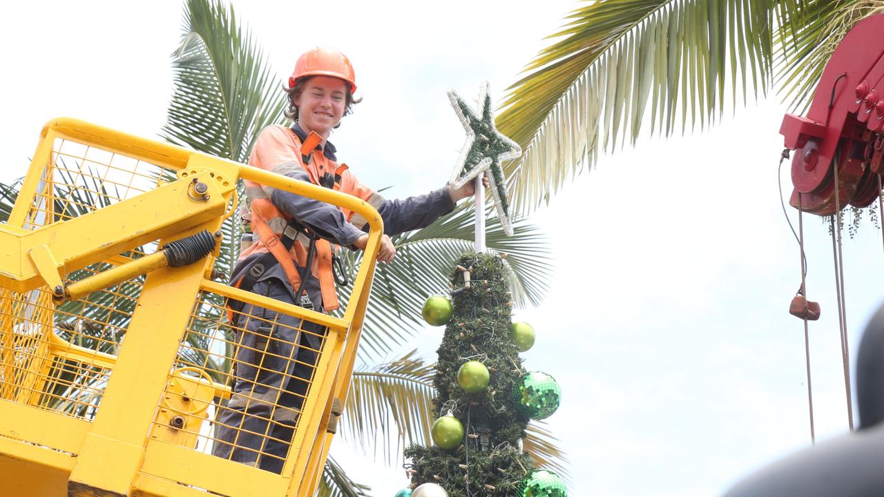 Bradley Farrelly dismantles the Port Douglas Christmas tree ahead of Cyclone Jasper's expected arrival. Picture: Peter Carruthers