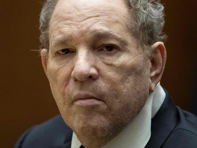 (FILES) Former film producer Harvey Weinstein appears in court at the Clara Shortridge Foltz Criminal Justice Center in Los Angeles, California, on 4 October 2022. UK prosecutors on September 5, 2024 said they were dropping a sexual assault case against Hollywood movie mogul Harvey Weinstein as there was no "realistic prospect of conviction". The Crown Prosecution Service (CPS) in June 2022 said it had authorised police to charge Weinstein with two counts of indecent assault but the CPS said it had now decided to "discontinue criminal proceedings" against him. (Photo by ETIENNE LAURENT / POOL / AFP)