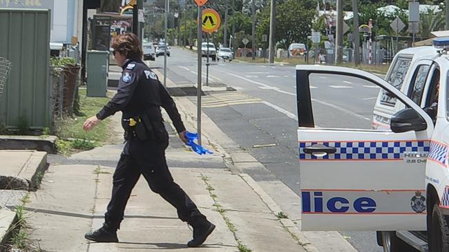 A police officer heads towards the Foodworks store on Main Street, Park Avenue, on Sunday, October 2.