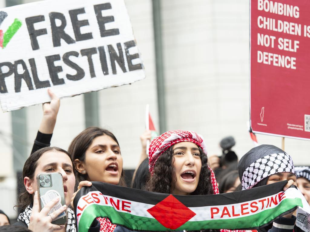 Students carry signs during the protest. Picture: NCA NewsWire / Monique Harmer