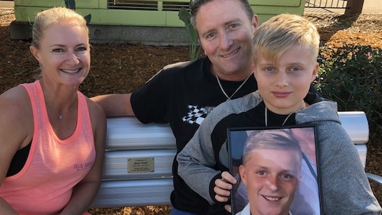 Simone, Darren and Cody Tickell at the garden seat bearing the plaque of their late son and 2017 Rouse Hill Times JSS Star Blake Tickell. Picture: Lawrence Machado