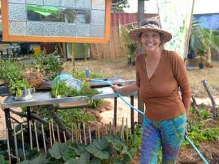 Proud mum Nicola Apps in her permaculture garden at son Leo's Tropical Bloom festival. Picture: Jann Houley