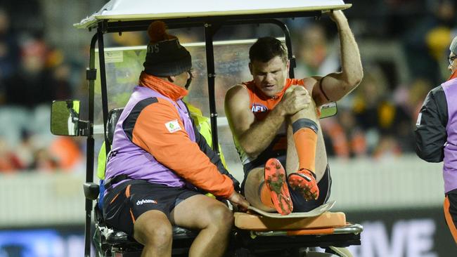 Heath Shaw is helped from the field after suffering a knee injury.