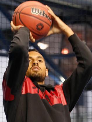 Nick Kyrgios swaps the tennis racquet for his real love, basketball. Picture: Getty Images