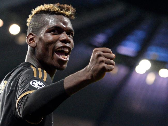 (FILES) This file photo taken on September 15, 2015 shows Juventus' midfielder from France Paul Pogba celebrating a goal during a UEFA Champions League group stage football match between Manchester City and Juventus at the Etihad stadium in Manchester, north-west England. French superstar Paul Pogba on August 9, 2016 completed a sensational return to Manchester United from Juventus for a reported world record fee. United said Pogba had signed a five-year contract but did not give the cost which British media have put at 89 million pounds ($116.4 million, 105 million euros), not including agent's fee. / AFP PHOTO / OLI SCARFF