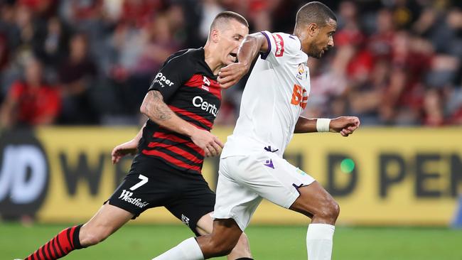 James Meredith and Mitchell Duke contest for the ball in round 15 of the A-League.