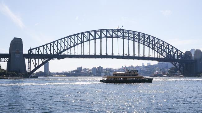 SYDNEY, AUSTRALIA: Newswire Photos : APRIL 15 2024: A view of the flags on the Sydney Harbour Bridge at half mast today in honour of the victims who were tragically lost their lives and for those injured and involved in the Bondi Westfields Shopping Centre massacre on Saturday. Picture: NCA Newswire / Gaye Gerard