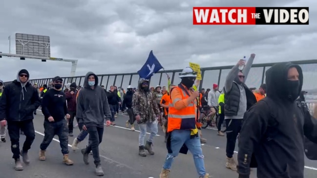 Protesters and construction workers march on the West Gate Fwy