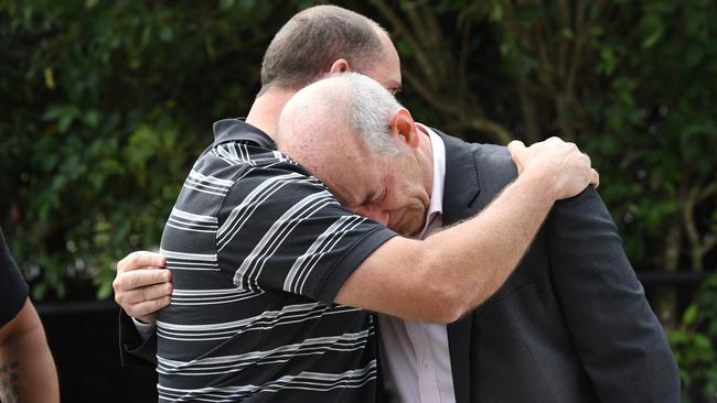 Matthew King, the father of Alex King, embraces Cornelius Brosnan, the father of Callum Brosnan, outside the NSW Coroners Court in September. Picture: Peter Rae/AAP