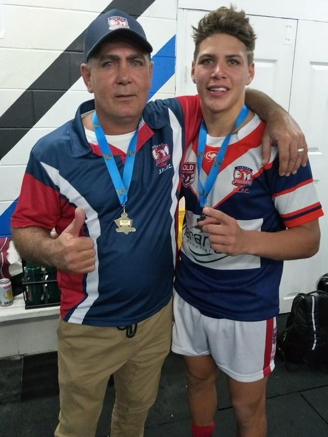 Reece Walsh with his father Rod after a junior grand final win for Nerang Roosters. Picture: Supplied