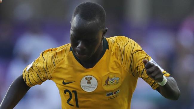 Jordan's midfielder Musa Al-Taamari, left, fights for the ball with Australia's midfielder Awer Mabil during the AFC Asian Cup group B soccer match between Australia and Jordan at Hazza bin Zayed stadium in Al Ain, United Arab Emirates, Sunday, Jan. 6, 2019. (AP Photo/Hassan Ammar)