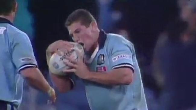 NSW Blues player Brian Fletcher mocks throwing a Rugby League ball as a hand grenade in 2000. Picture courtesy: Channel Nine