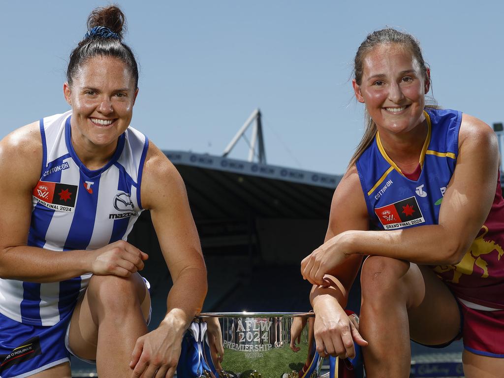 North Melbourne skipper Emma Kearney (left) and Brisbane captain Bre Koenen (right) pose with the AFLW premiership cup the day before the Grand Final. Picture: Michael Klein