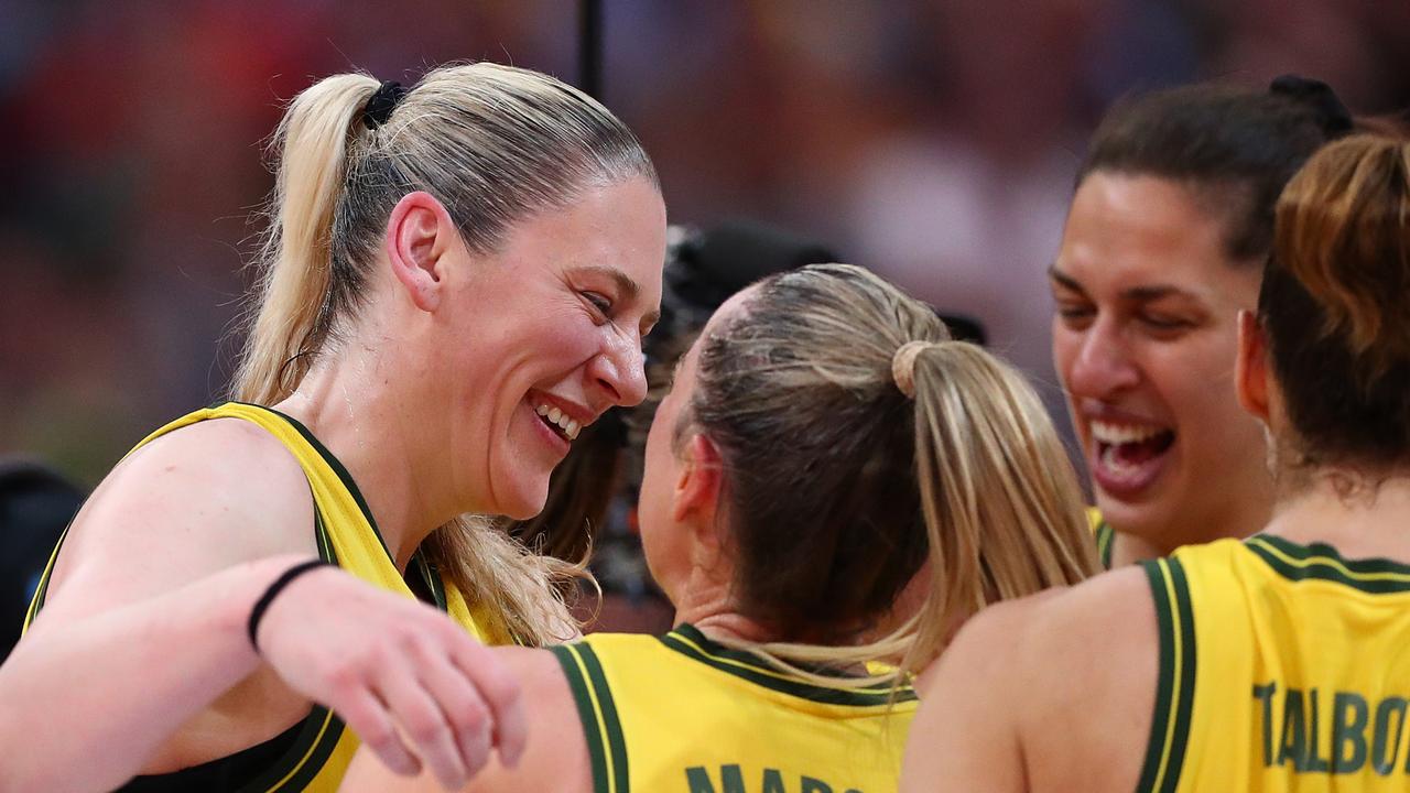 Lauren Jackson embraces her teammates after the win over Canada.