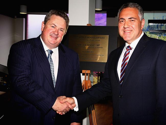 Joe Hockey (right) with Andrew Burnes at the opening of a new tourism business headquarters in 2013 in Melbourne. Picture: Hamish Blair 