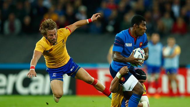 LONDON, ENGLAND - SEPTEMBER 23: Noa Nakaitaci of France is tackled by Valentin Ursache (ground) and Florin Surugiu (L) of Romania during the 2015 Rugby World Cup Pool D match between France and Romania at the Olympic Stadium on September 23, 2015 in London, United Kingdom. (Photo by Mike Hewitt/Getty Images)