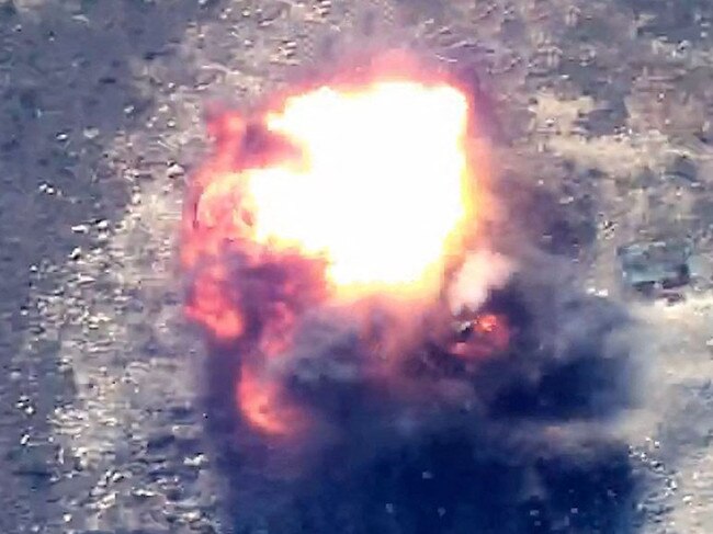 This grab taken from a handout footage released by the Azerbaijani Defence Ministry on September 19, 2023 show an explosion in mountainous terrain, that Baku claims to be Azerbaijani forces "destroying positions" used by Armenians in the Nagorno-Karabakh region. Azerbaijan said on September 19, 2023 it had launched "anti-terrorist operations" in the disputed region, over which the Caucasus arch-rivals fought a brief but brutal war in 2020. (Photo by Handout / Azerbaijani Defence Ministry / AFP) / RESTRICTED TO EDITORIAL USE - MANDATORY CREDIT "AFP PHOTO / Azerbaijani Defence Ministry / handout" - NO MARKETING NO ADVERTISING CAMPAIGNS - DISTRIBUTED AS A SERVICE TO CLIENTS