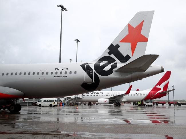 A Jetstar Airbus A380 and Qantas Boeing 737-800  jet aircraft at Cairns Airport after touchdown, bringing tourists and tourism dollars to Far North Queensland. Picture: Brendan Radke