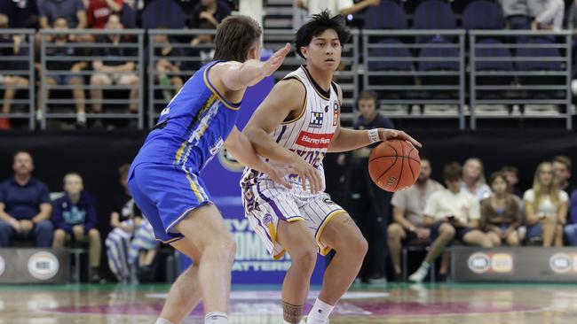 GOLD COAST, AUSTRALIA - SEPTEMBER 22: Jasper Rentoy of the Kings dribbles the ball during the 2023 NBL Blitz match between Sydney Kings and Brisbane Bullets at Gold Coast Convention and Exhibition Centre on September 22, 2023 in Gold Coast, Australia. (Photo by Russell Freeman/Getty Images for NBL)