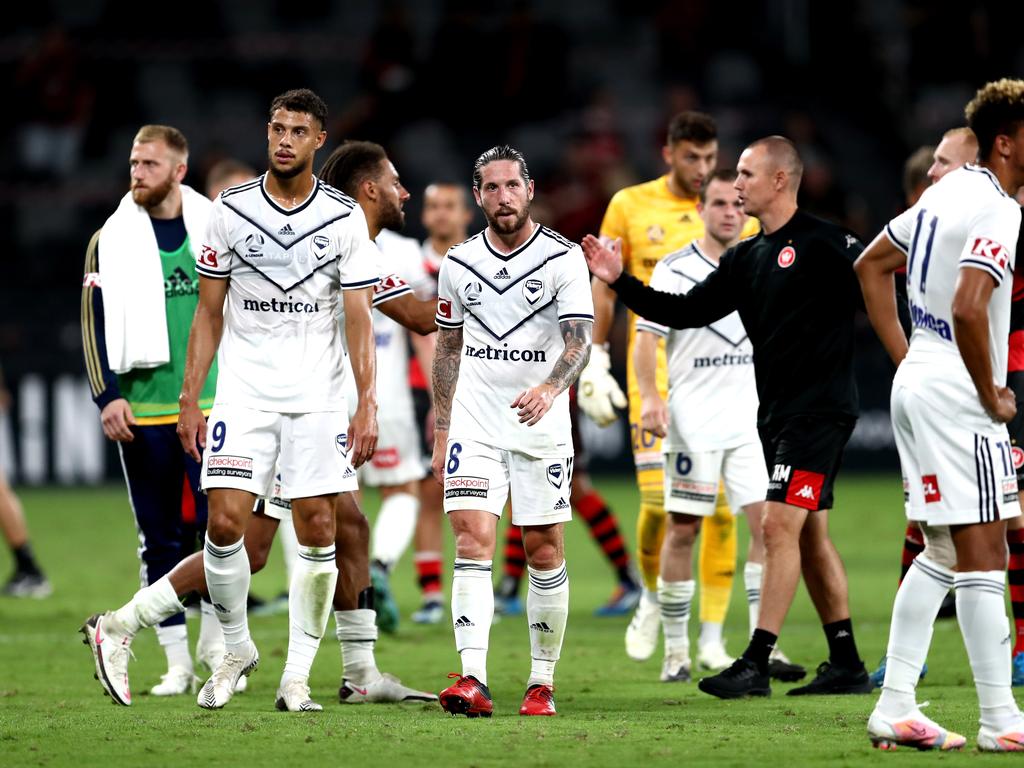 Melbourne Victory players are dejected following yet another loss. Picture: Brendon Thorne/Getty Images