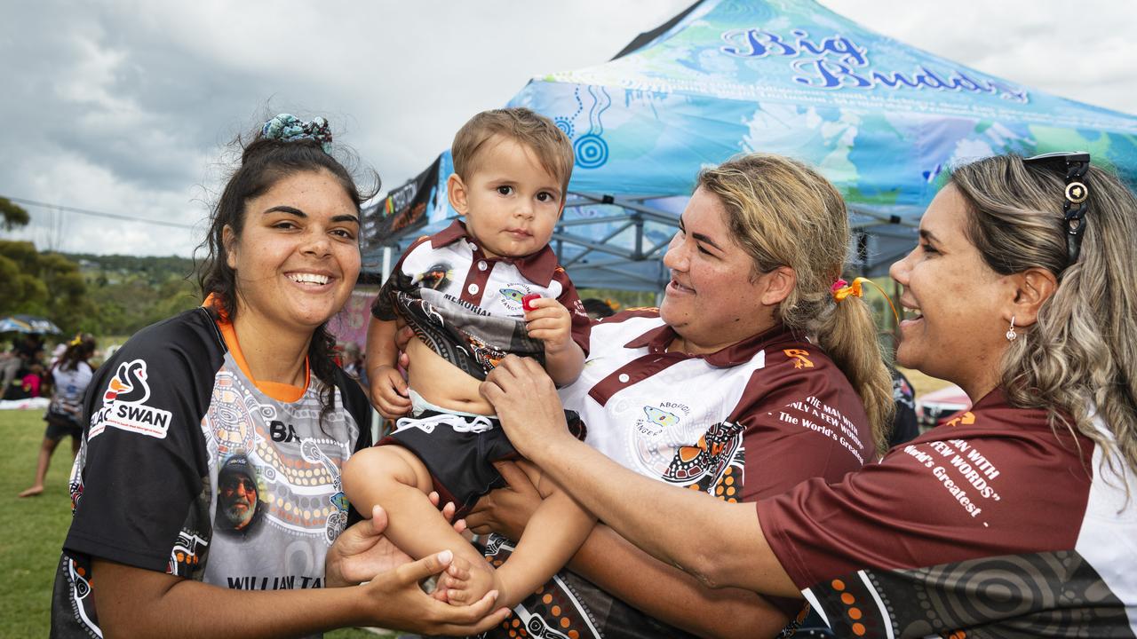 William Taylor Memorial players and supporters (from left) Akira Kelly, DJ Glenbar held by mum Kiara Taylor, and Mikala Logan-Gordon at the Warriors Reconciliation Carnival hosted by Toowoomba Warriors at Jack Martin Centre, Saturday, January 18, 2025. Picture: Kevin Farmer