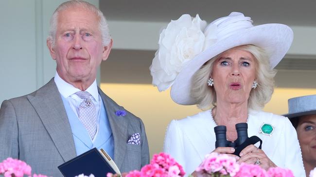 ASCOT, ENGLAND - JUNE 20: King Charles III and Queen Camilla react as they attend day three of Royal Ascot 2024 at Ascot Racecourse on June 20, 2024 in Ascot, England. (Photo by Chris Jackson/Getty Images)