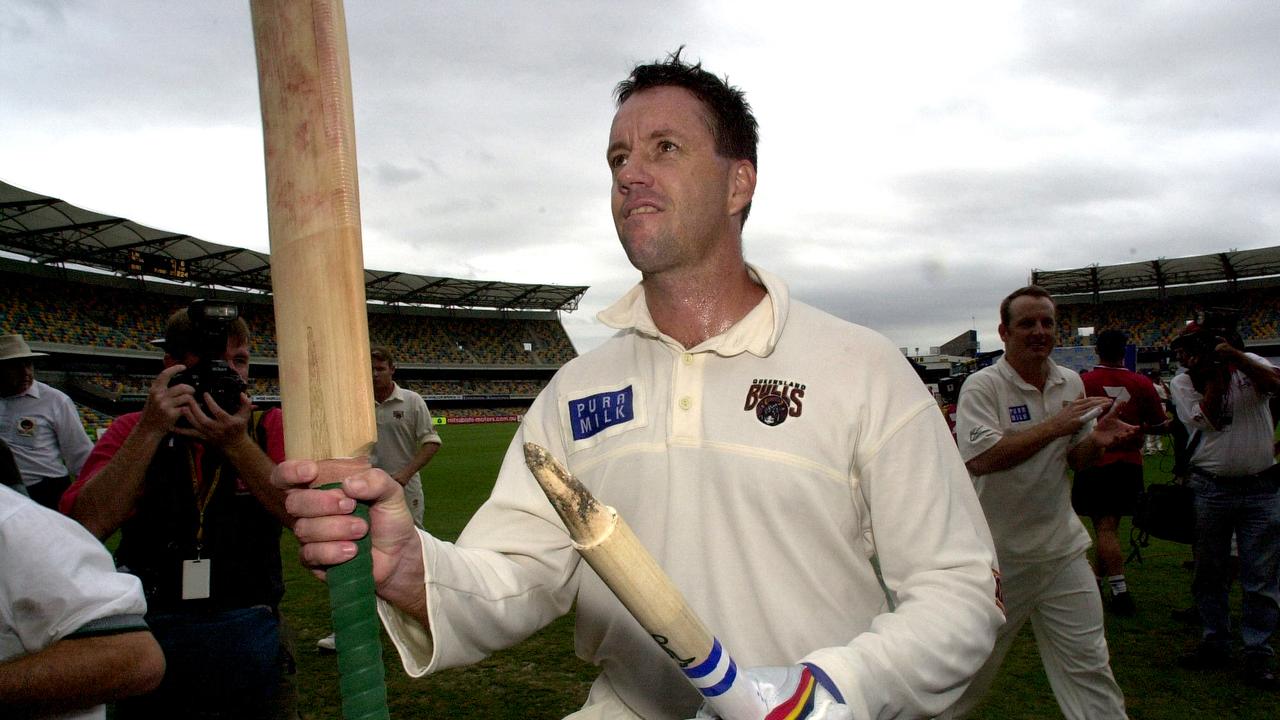 Queensland captain Stuart Law salutes team mates after yet another finals victory. Pic Patrick Hamilton. Cricket