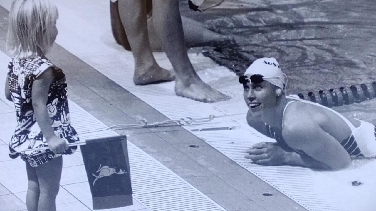 Lisa Curry and Jaimi Kenny on the pool deck at Auckland Commonwealth Games 1990. Picture: Jim Fenwick