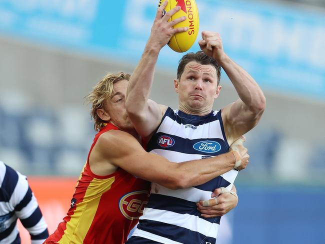 AFL Round 5. Collingwood v Essendon at the MCG. 03/07/2020.    Patrick Dangerfield of the Cats tries to clear as he is tackled by Hugh Greenwood of the Suns  . Pic: Michael Klein