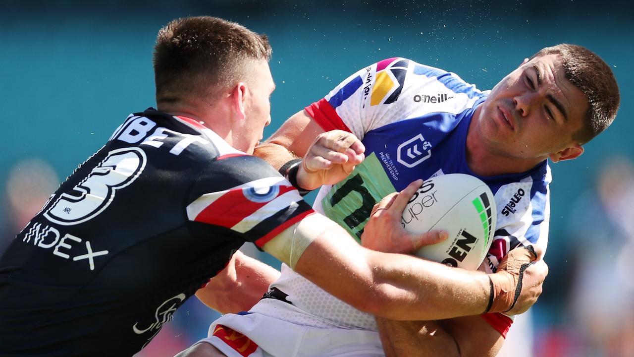 Victor Radley (left) was dazed after a big hit on Newcastle five-eighth Jake Clifford. Picture: Matt King/Getty Images