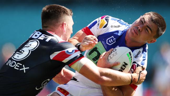 Victor Radley (left) was dazed after a big hit on Newcastle five-eighth Jake Clifford. Picture: Matt King/Getty Images